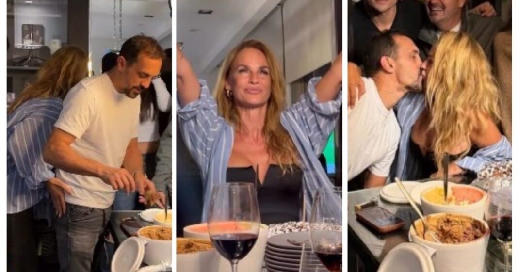 Sabrina Rojas soplando una vela en su cumpleaños, rodeada de amigos y su pareja José Chatruc
